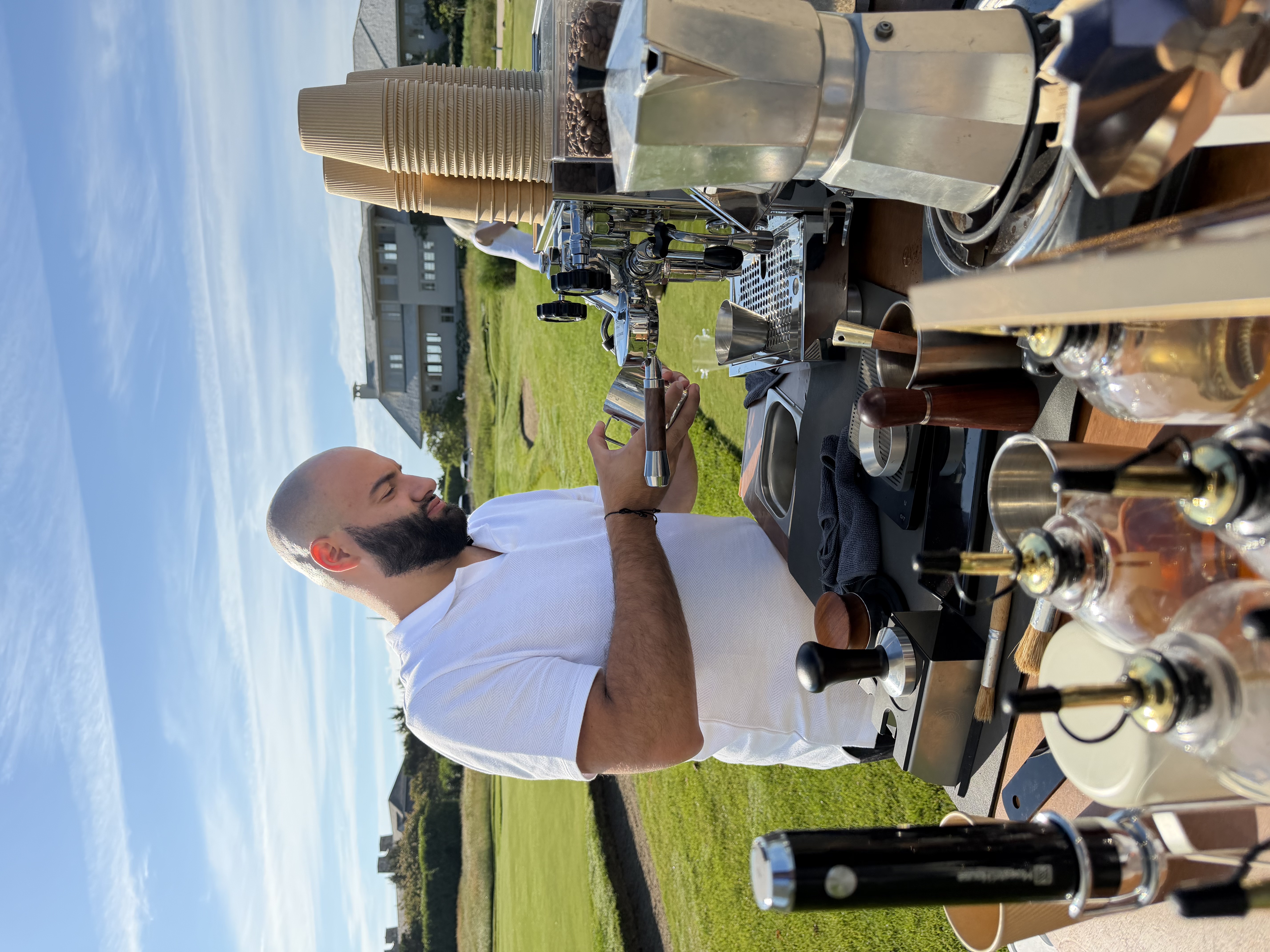 Brewed Moments Coffee Cart barista serving espresso drinks at a New York event